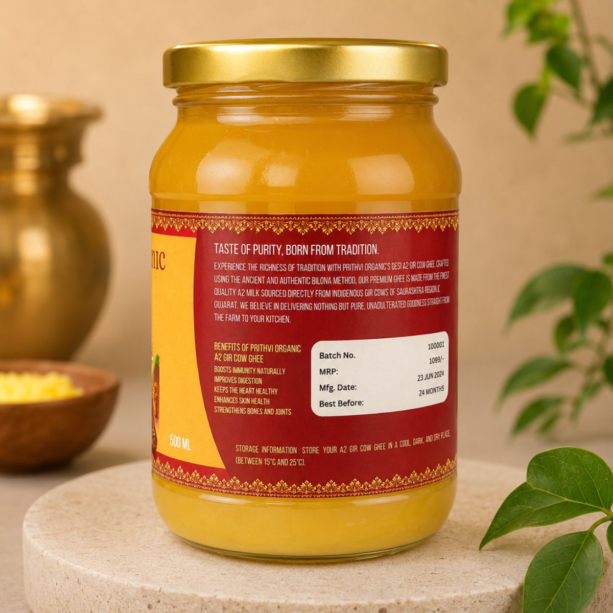 A jar of organic A2 Gir cow ghee is shown from the back, displaying its red and yellow label with product details.
